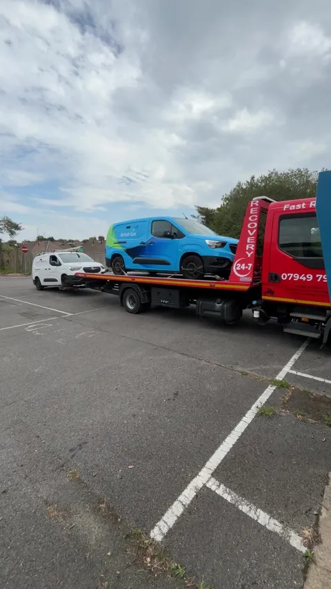 Blue British Gas van loaded on the recovery truck